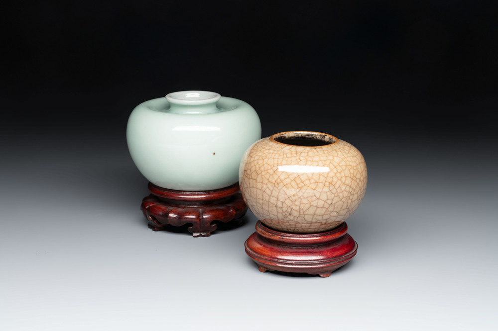 A Chinese celadon-glazed water pot and a ge-type water pot on wooden stands, Qianlong mark, 19th C.