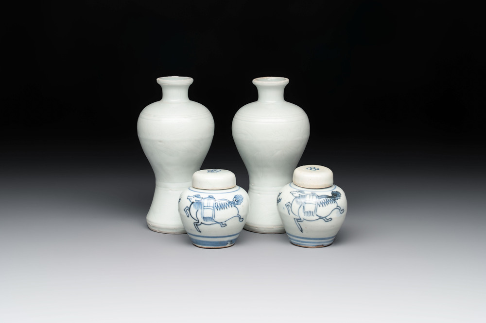 A pair of Chinese white-glazed vases and a pair of blue and white covered jars, Wanli mark and of the period