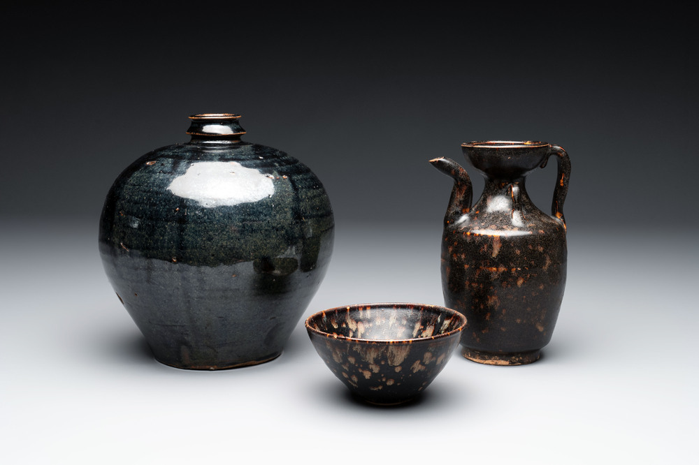 A Chinese Jizhou tortoiseshell-glazed tea bowl, a ewer and a black-glazed vase, Jin and later