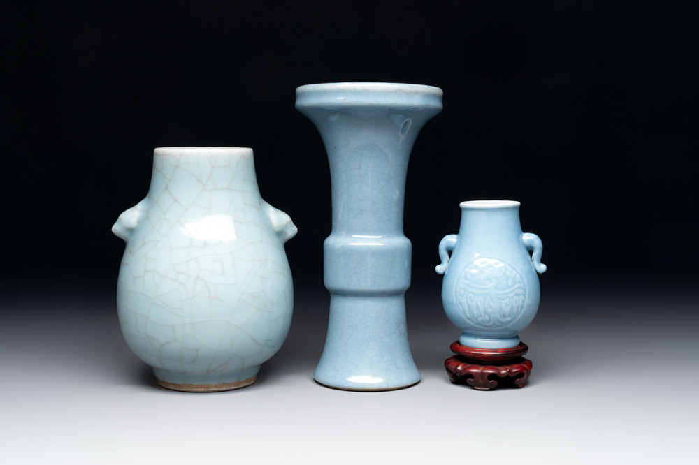 Three Chinese claire-de-lune vases, one with a wooden stand, Yongzheng mark, 19/20th C.