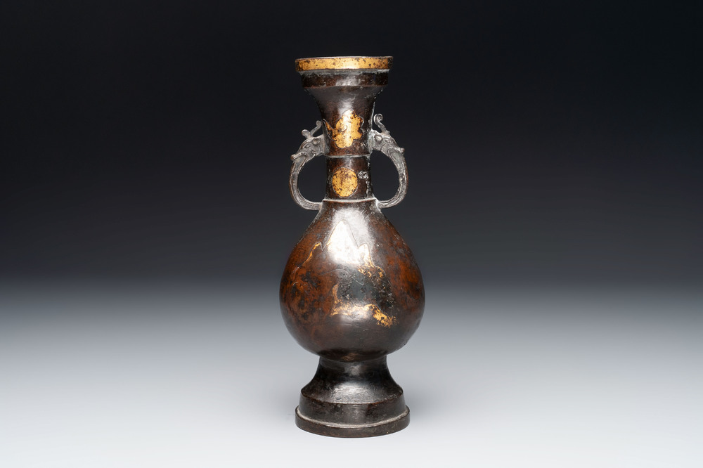 A Chinese parcel-gilt bronze vase with dragon-form handles, Yuan/Ming