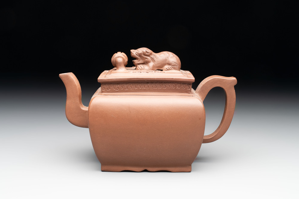 A Chinese Yixing stoneware 'lion and brocade ball' teapot and cover, Qianlong