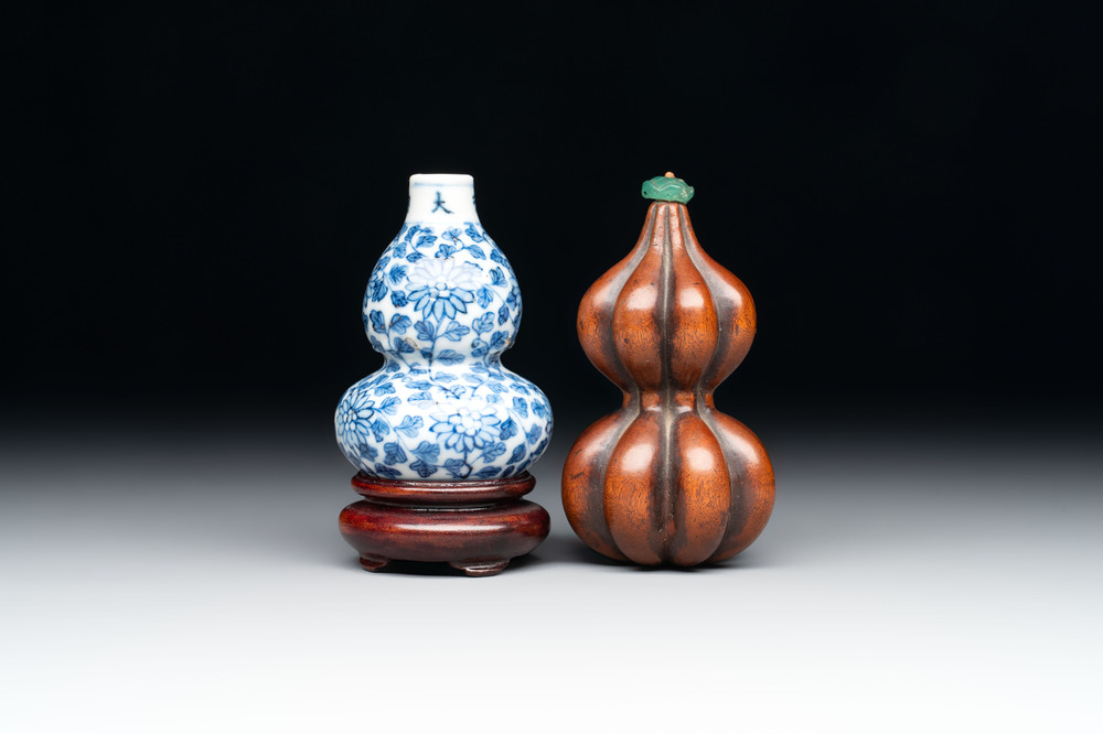 A Chinese blue and white double-gourd snuff bottle and a huali snuff bottle, Xuande and Qianlong mark, 18th C.