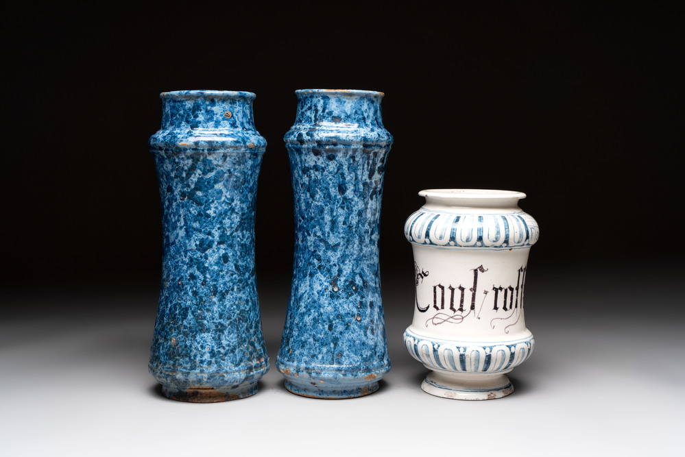A pair of Spanish splashed blue pottery albarelli and an Italian blue, white and manganese albarello, Savona, 17/18th C.