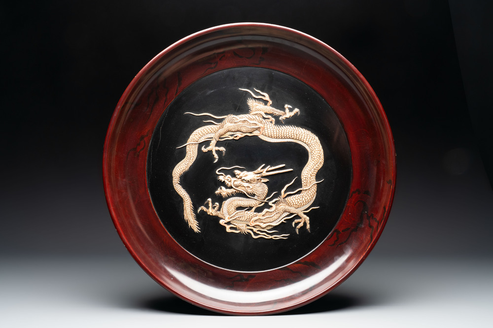 A large Japanese mother-of-pearl and bone-inlaid lacquer 'dragon' dish, Meiji, 19th C.