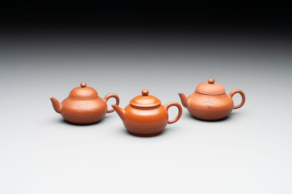 A small Chinese Yixing stoneware covered teapot and two Swatow Yixing-style covered teapots, Yixing Hui Mengchen 宜興惠孟臣製 and Shunji 順記 marks, 19/20th C