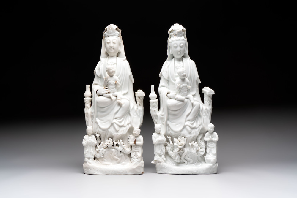 A pair of Chinese Dehua blanc de Chine groups of Guanyin with a child and servants, 18th C.