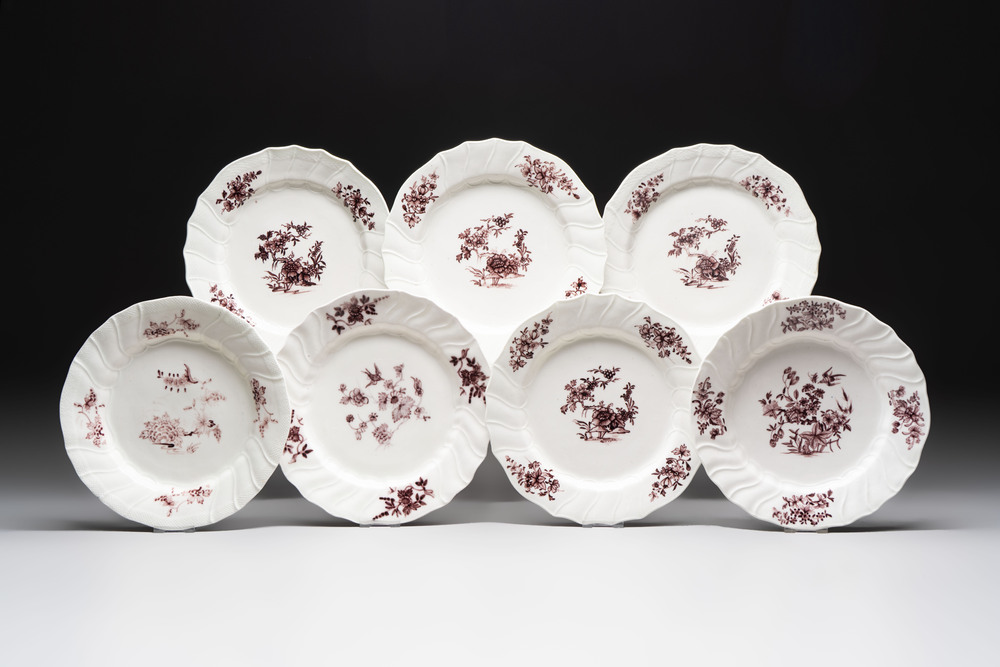 Seven manganese Tournai porcelain plates with floral design, 18th C.