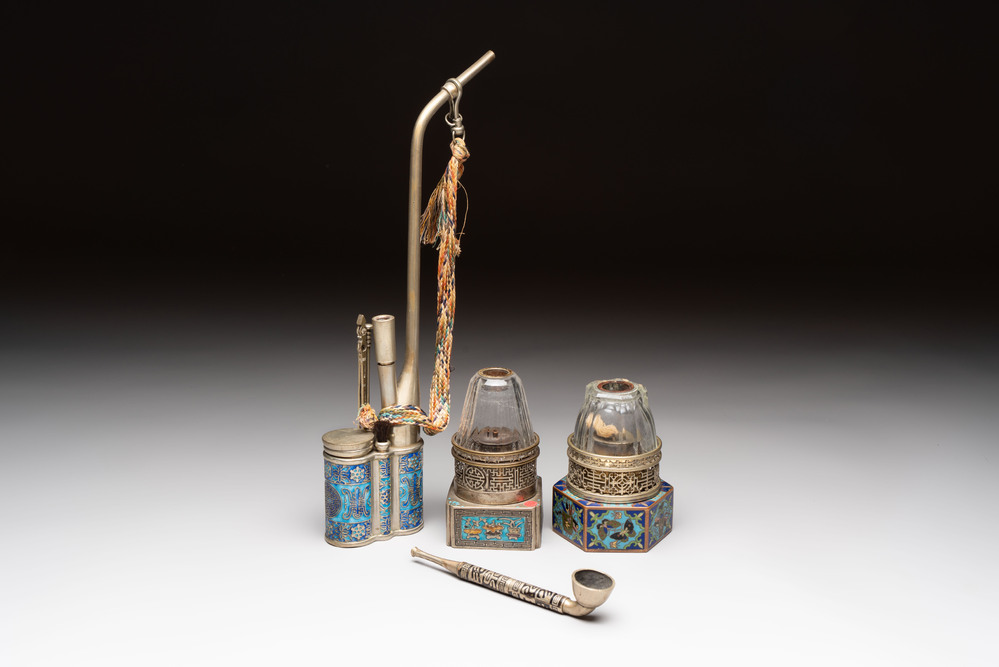 Two Chinese enamelled paktong opium pipes, an opium lamp and a cloisonn&eacute; opium lamp, 19/20th C.