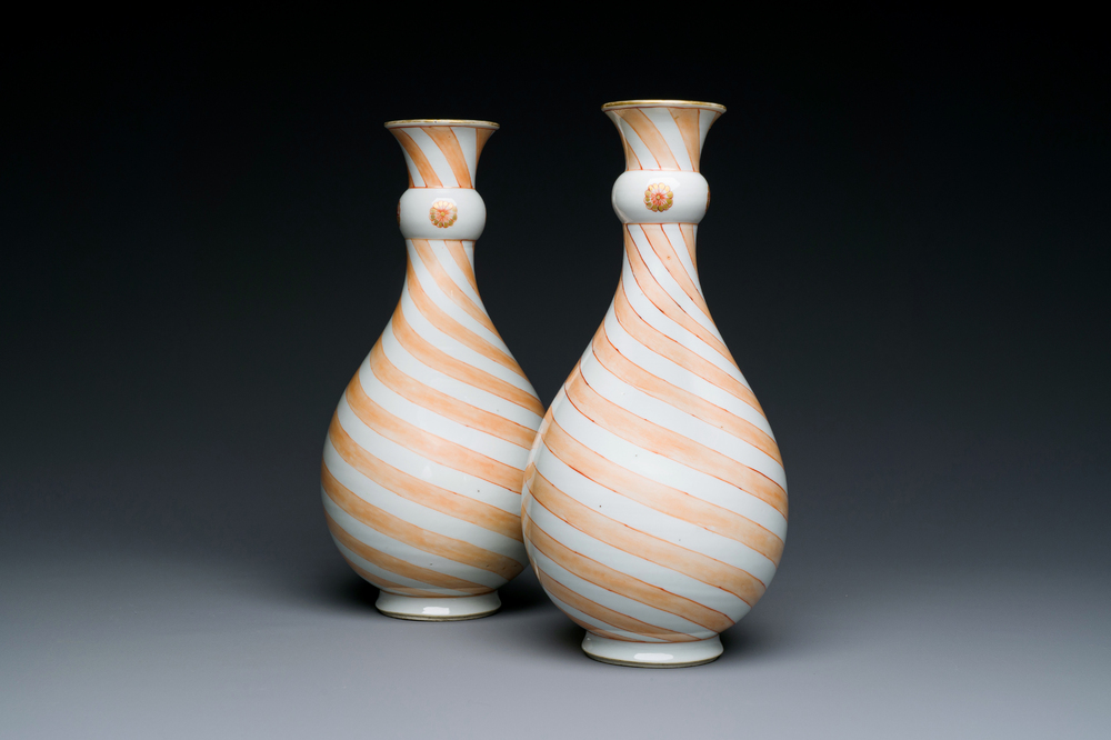 A rare pair of Chinese pear-shaped bottle vases with iron-red swirls, Kangxi