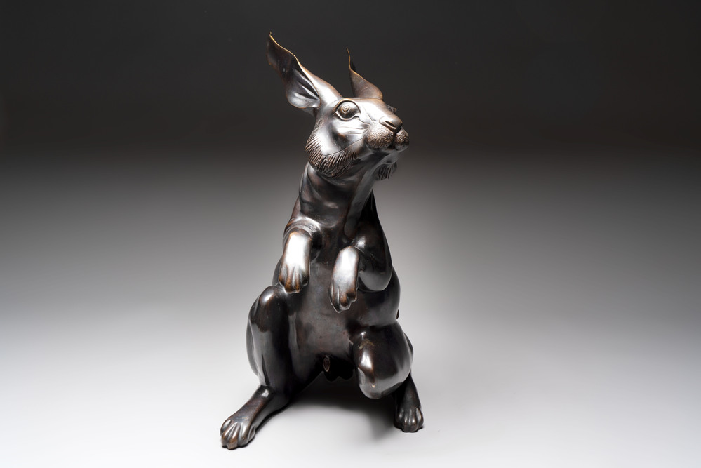 A large Japanese bronze sculpture of a sitting hare, 20th C.