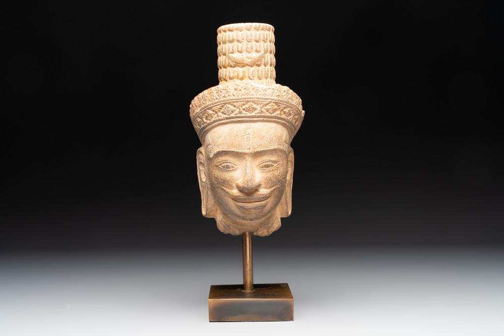 A Khmer Angkor Wat-style sandstone head of Shiva, probably 12th C.