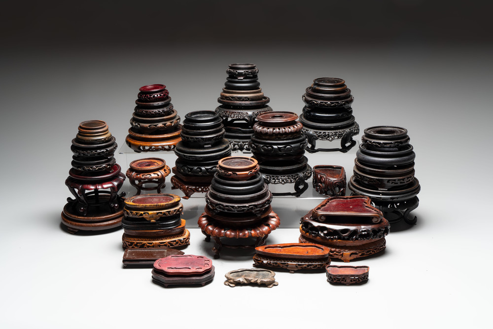 A collection of 51 Chinese wooden stands, 19/20th C.