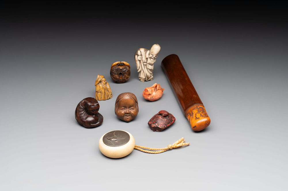 A varied collection of eight Japanese netsukes and a wooden case, signed Daimyo 大明, Hinode 日出 and Chikusen 竹仙, 19th C.