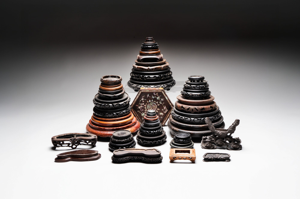 A collection of 37 Chinese wooden stands, 19/20th C.