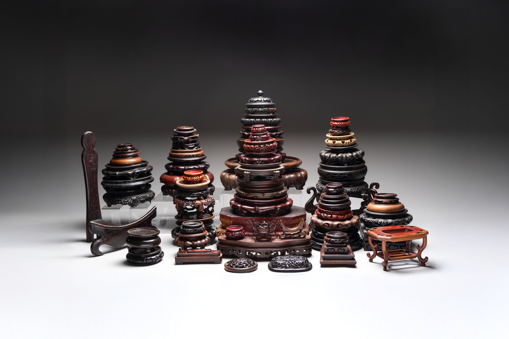 A collection of 70 Chinese wooden stands and covers, 19/20th C.