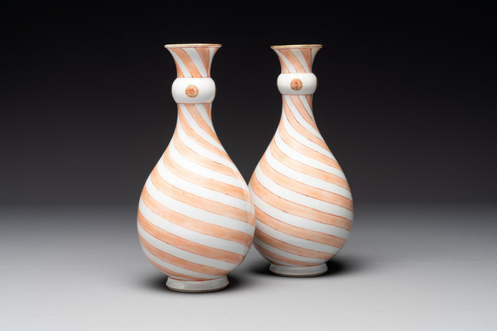 A rare pair of Chinese pear-shaped bottle vases with iron-red swirls, Kangxi