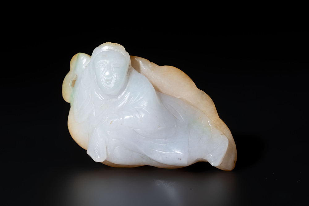 A Chinese white and yellow jade carving of a reclining lady on a leaf, Qing