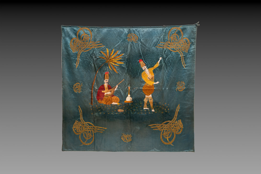 A rare and fine Ottoman oil-painted and embroidered silk panel depicting Basi Bozuic, 18/19th C.