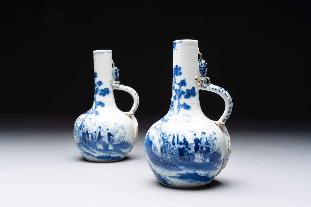 A pair of Chinese blue and white wine jugs with a chilong-form handle, possibly for the Vietnamese market, 19th C.