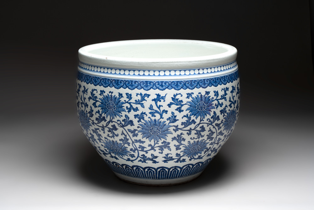 A massive Chinese blue and white 'lotus scroll' fish bowl, Qianlong/Jiaqing