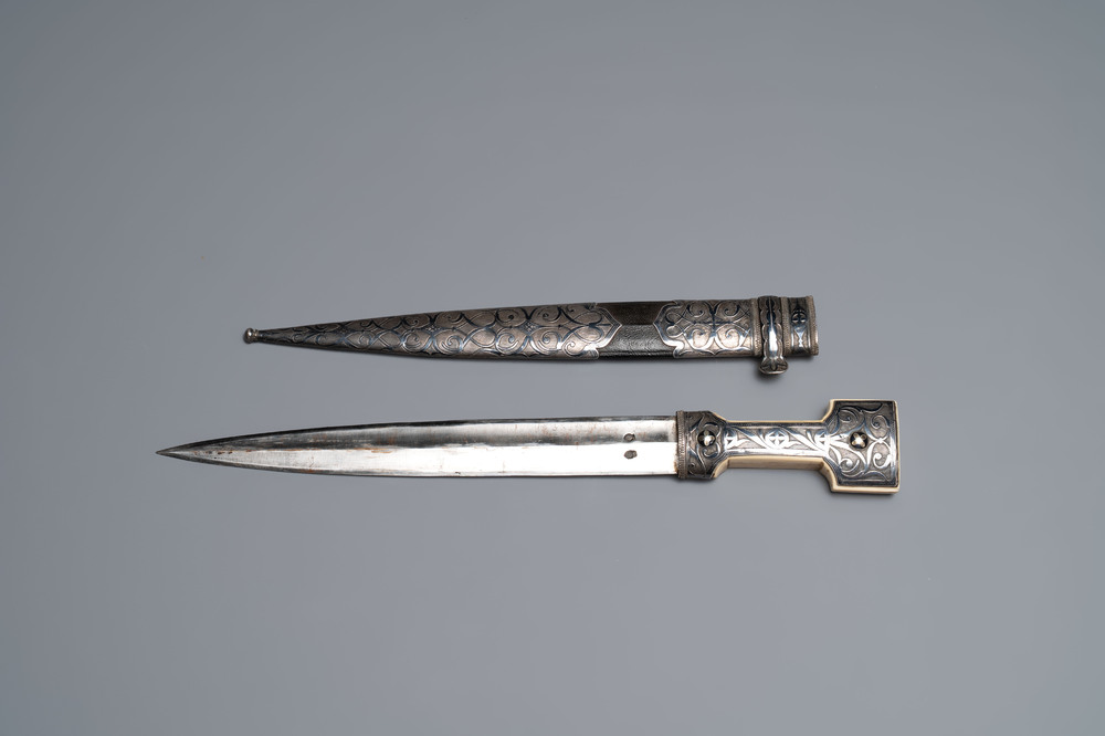 A Caucasian walrus bone-hilted kindjal with niello silver mounts, 19th C.