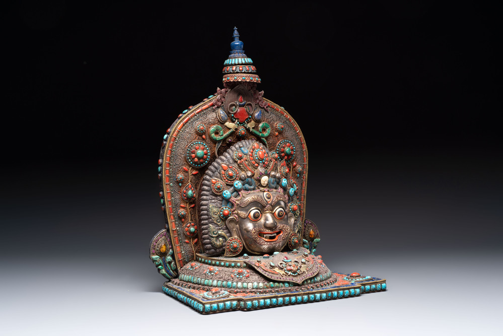 A fine large Nepalese red coral and precious stone-inset brass and silver filigree 'Bhairava' mask, 19th C.