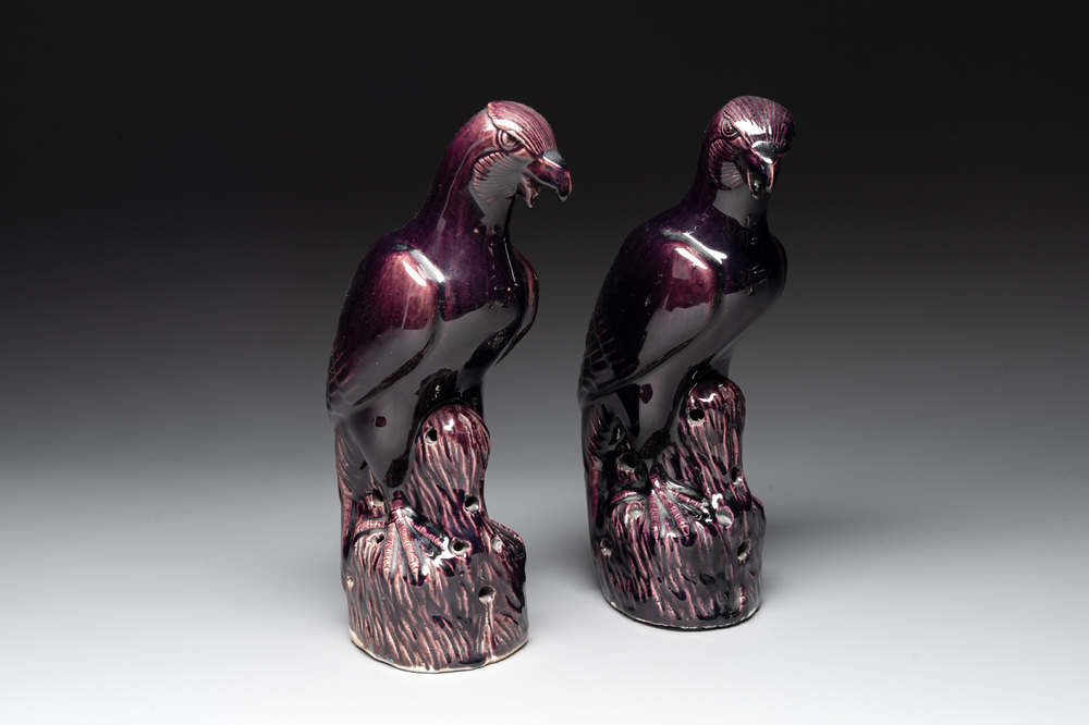 A pair of Chinese aubergine-glazed eagles, 19th C.