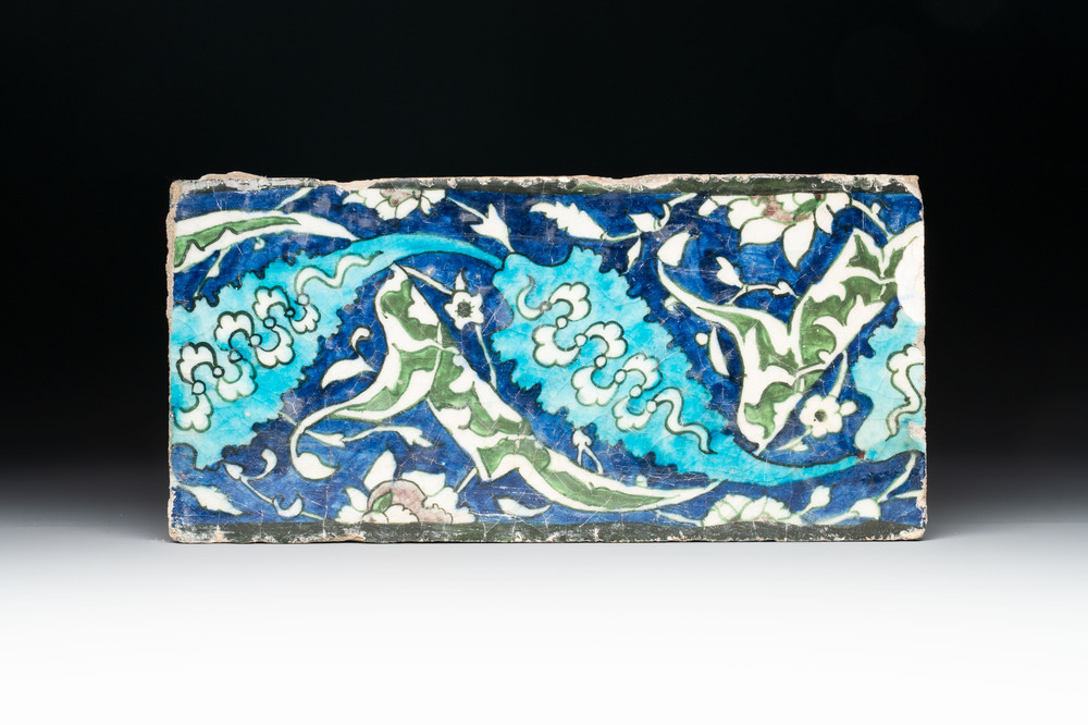 A polychrome Damascus pottery border tile with floral design, 17th C.