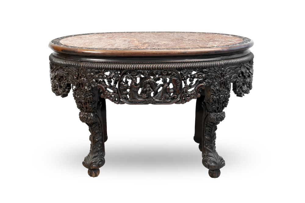 A Chinese finely carved hongmu marble top oval table, Canton, 19th C.