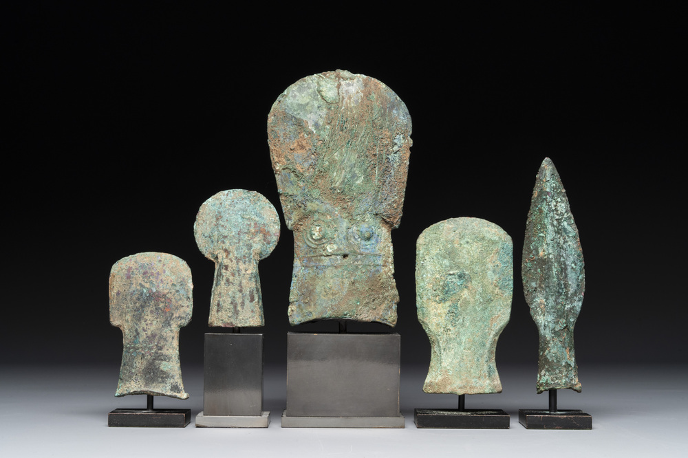 Four Chinese and Vietnamese bronze axes and an arrowhead, Western Zhou/Dong Son