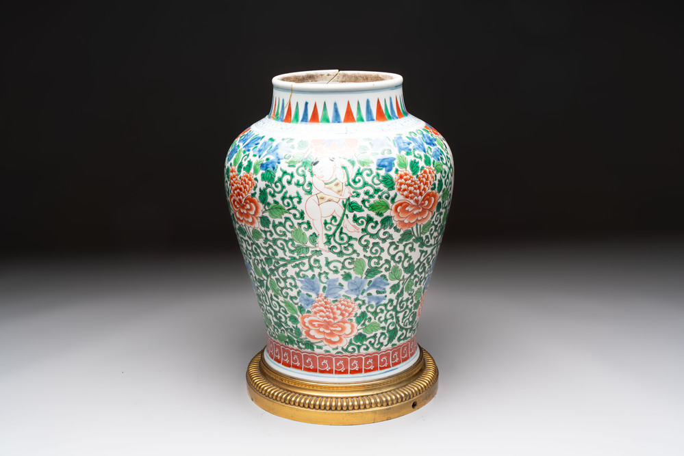 A Chinese wucai 'He He Er Xian' vase on gilt-bronze stand, 19th C.