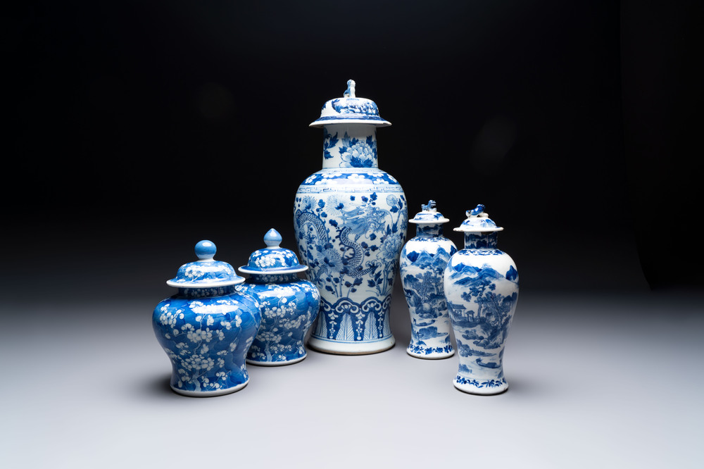 Two pairs of Chinese blue and white covered vases and a large covered vase, 19th C.