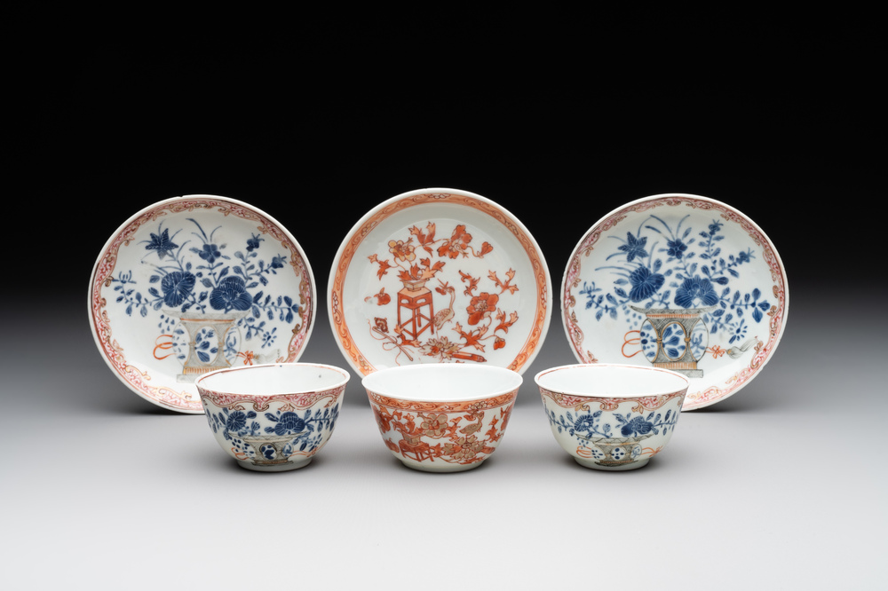 A pair of Chinese polychrome-decorated cups and saucers and an iron-red gilt-decorated cup and saucer, Yongzheng/Qianlong