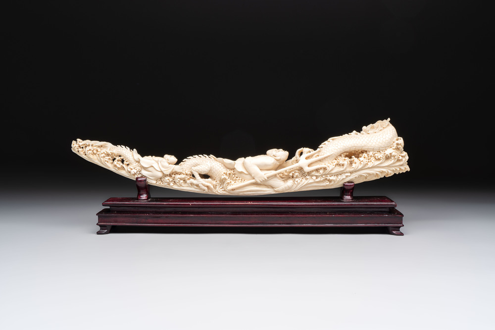 A Chinese ivory carving depicting a Luohan and a dragon, 'Da Ming 大明' mark, 19/20th C.