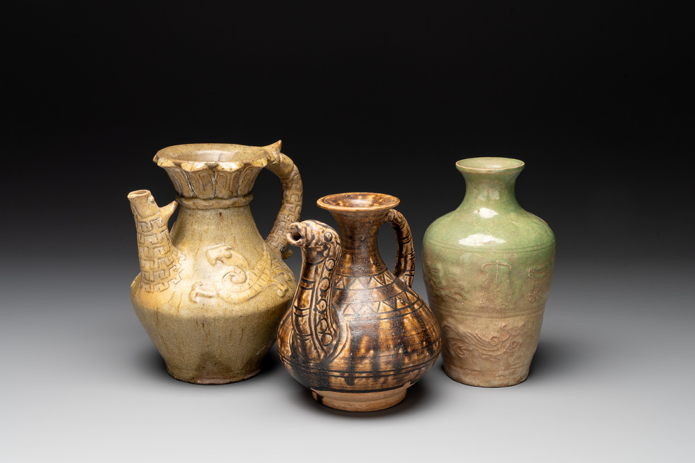 Two Chinese brown-glazed ewers and a celadon-glazed vase, one ewer dated 1571 with a Longqing mark, Qing and later