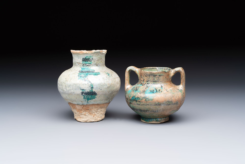 Two Raqqa turquoise-glazed pottery jars with black design, Syria, 12/13th C.