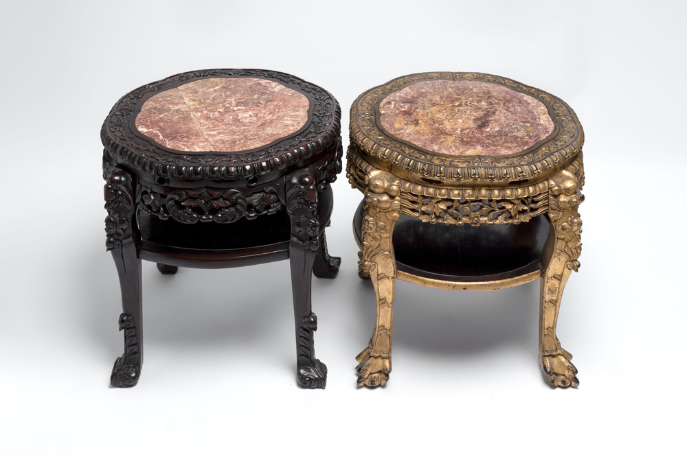 Two Chinese marble-topped hongmu two-tier stands, one with later gilding, 19/20th C.