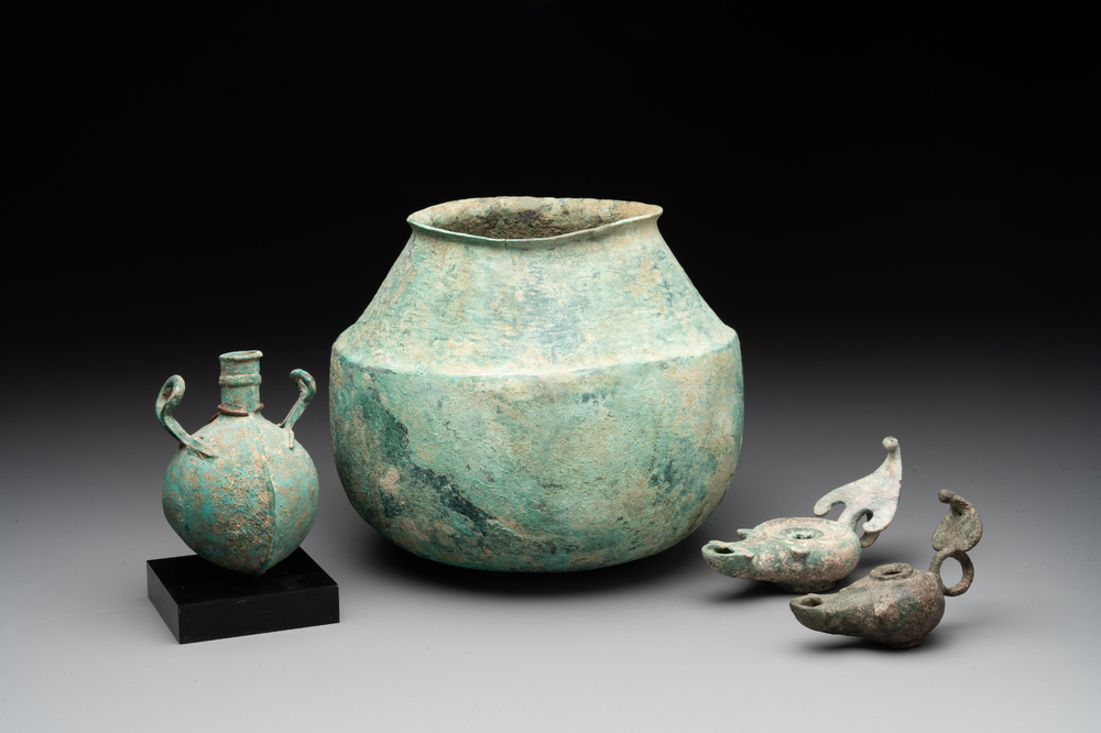 A bronze urn, a bronze canteen with relief design and a pair of bronze oil lamps, Etruscan and Roman civilizations, 9th C. B.C/5th C.
