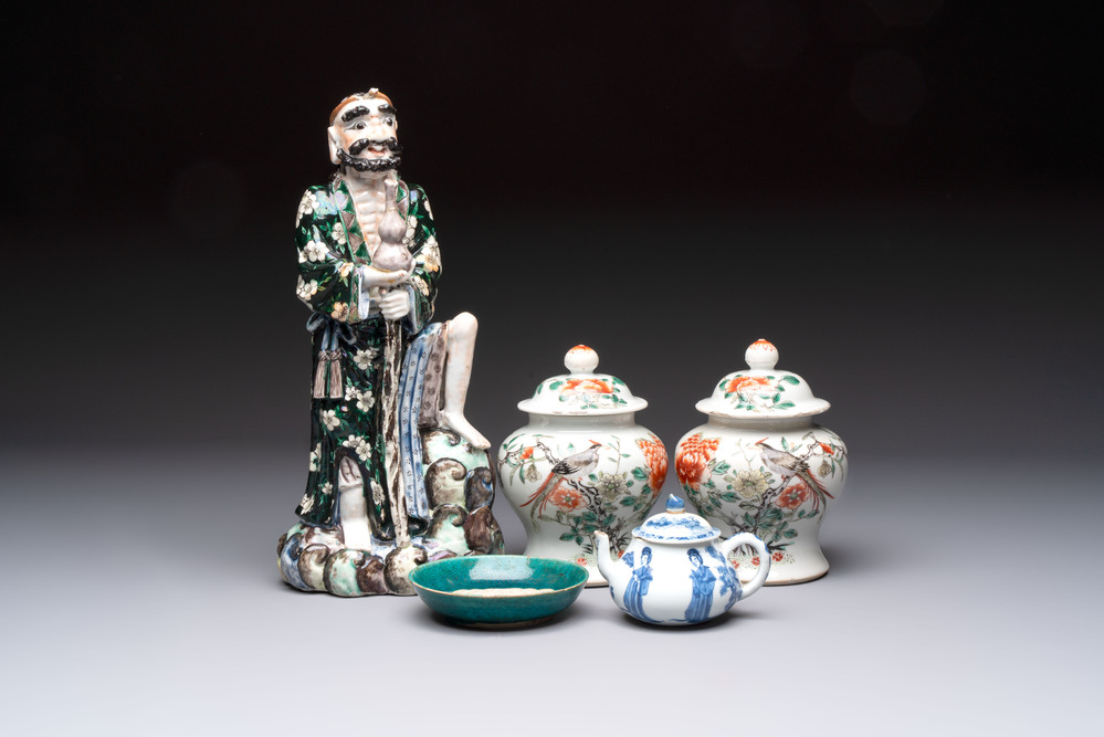 A pair of Chinese famille verte covered jars, a Tieguai Li figure, a blue and white teapot and a biscuit saucer, Kangxi and Qing Yu Tang mark, 19th C.