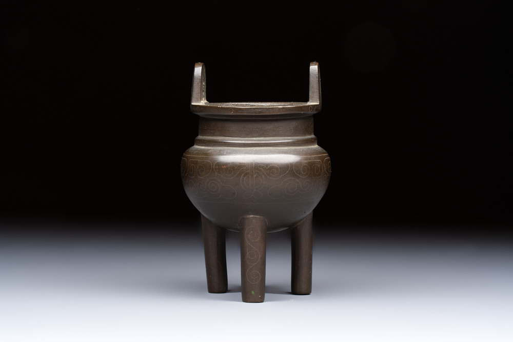 A Chinese silver-inlaid bronze tripod censer with clouds design, 19th C.