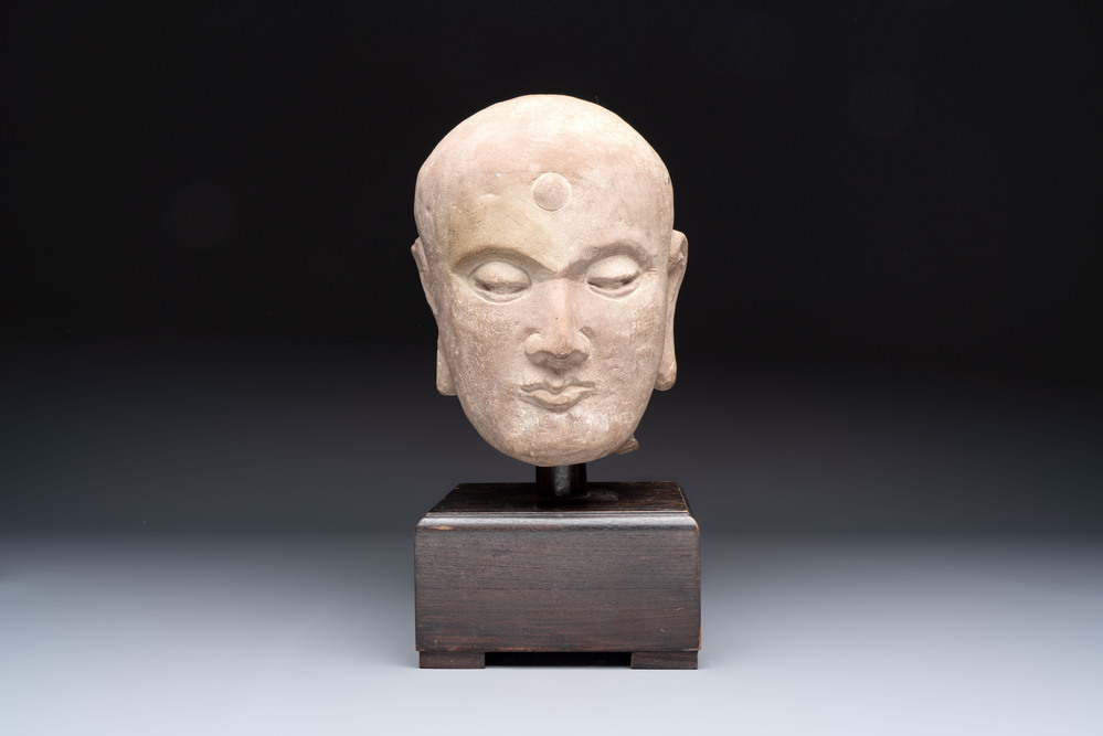 A Chinese sandstone head of a Luohan, early Qing