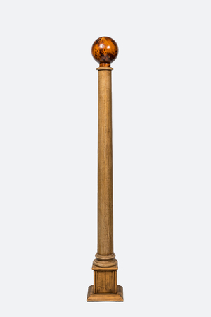 A large decorative wooden column topped with a root wood sphere, 20th C.