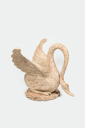 A large patinated wooden swan, 20th C.