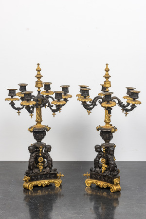 A pair of French partly gilt bronze 'atlants' candelabra, 19th C.