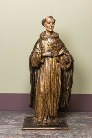 A polychromed and gilt walnut figure of a friar, Spain, 17th C.