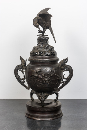 A large Japanese patinated bronze koro on stand with birds, dragons and blossoming branches, Meiji, 19th C.