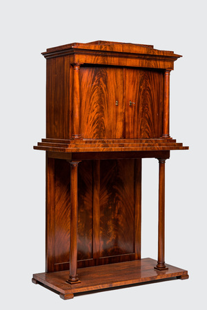 A neoclassical mahogany cabinet on stand, 19th C.