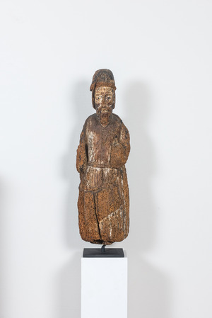 A Romanesque wooden figure of an apostle with traces of polychromy, probably Flanders, 14th C.