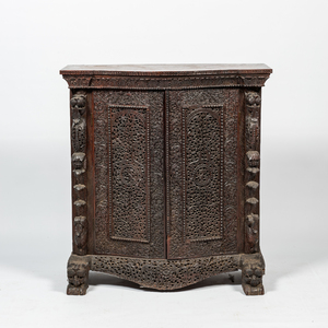 An Anglo-Indian colonial carved wooden two-door cabinet, 19th C.